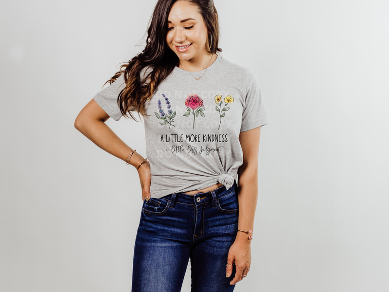 Woman wearing grey t-shirt with flower graphics