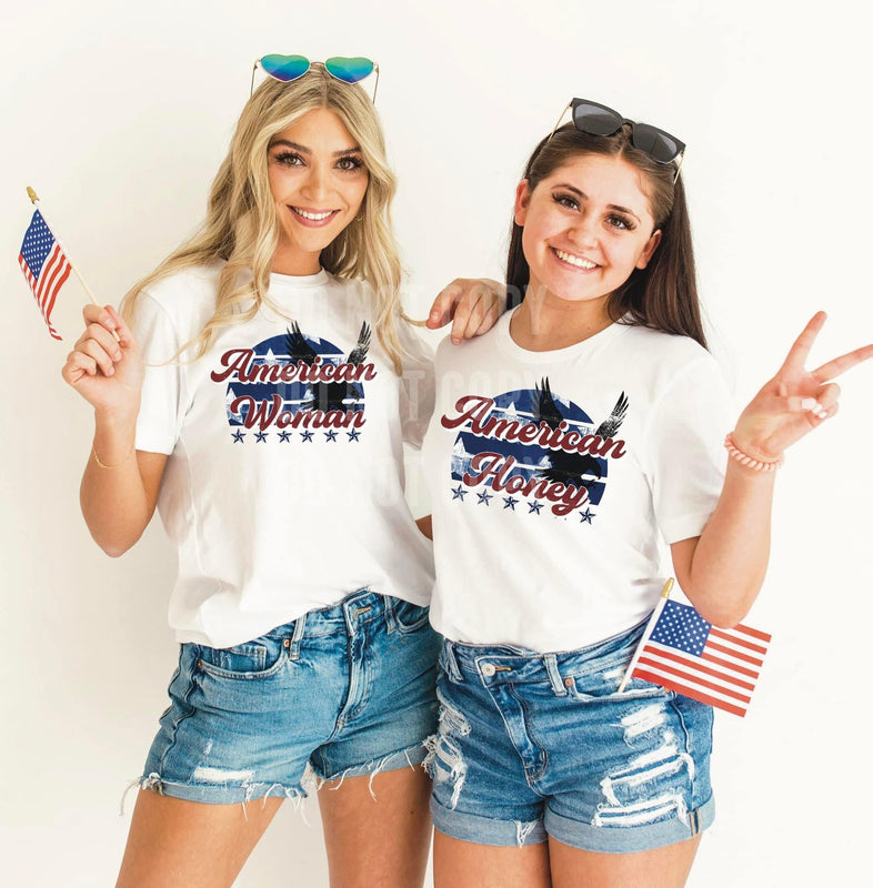 Two women wearing white T-shirts with “American Honey” designs.